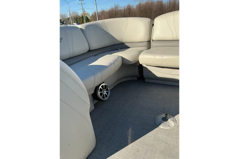 Slide: The Image of 2016 Starcraft SLS 3 boat interior with beige seating and speaker. - 15