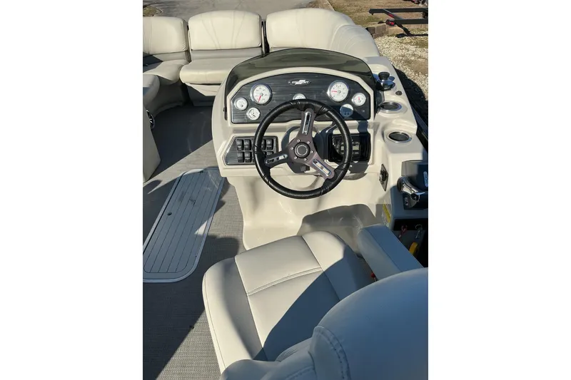 Slide: The Image of Interior view of 2016 Starcraft SLS 3 boat dashboard and steering wheel. - 6