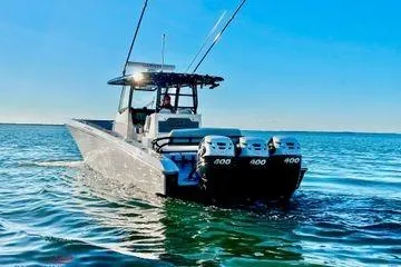 The Image of 2023 Fountain 38 Tournament Edition boat with triple 400 engines on open water. - 1