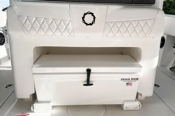 Slide: The Image of 2023 Fountain 38 Tournament Edition boat interior with storage compartment and cooler. - 13