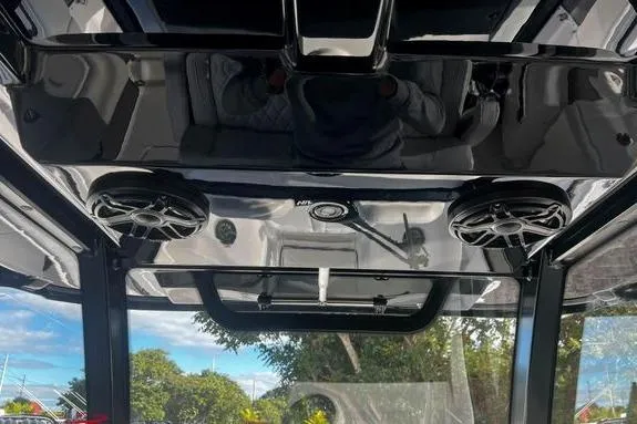 Slide: The Image of 2023 Fountain 38 Tournament Edition boat interior with speakers and sleek design. - 22