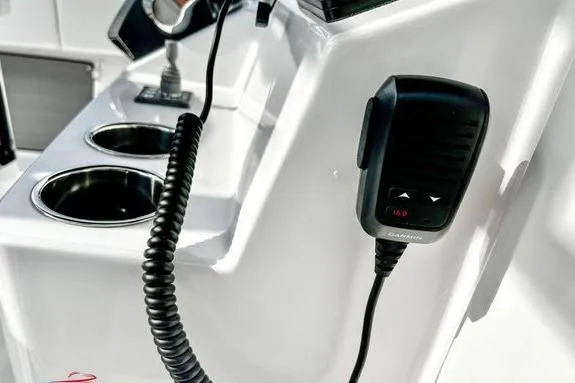 Slide: The Image of 2023 Fountain 38 Tournament Edition boat console with Garmin radio and cup holders. - 27