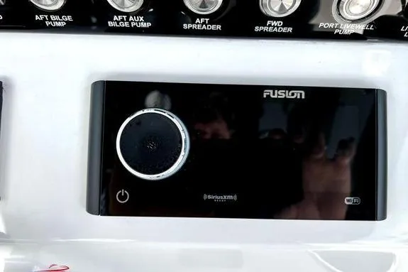 Slide: The Image of Control panel of 2023 Fountain 38 Tournament Edition boat with Fusion audio system. - 28