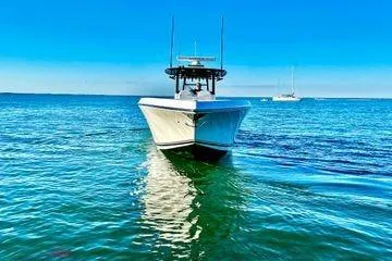 Slide: The Image of 2023 Fountain 38 Tournament Edition boat on clear blue water. - 3