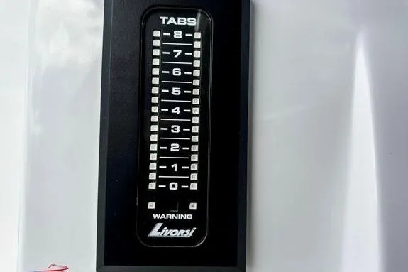 Slide: The Image of Livorsi trim tab indicator on 2023 Fountain 38 Tournament Edition boat dashboard. - 33