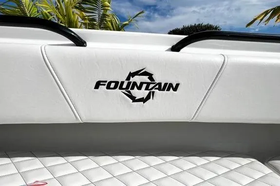 Slide: The Image of 2023 Fountain 38 Tournament Edition boat interior with logo, white quilted seating. - 42