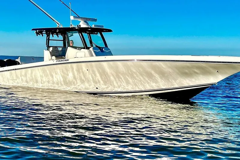Slide: The Image of 2023 Fountain 38 Tournament Edition boat cruising on clear blue water. - 5