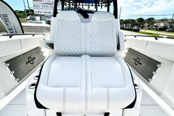 Slide: The Image of 2023 Fountain 38 Tournament Edition boat with luxurious white seating and diamond stitching. - 52