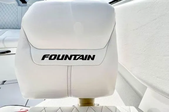 Slide: The Image of 2023 Fountain 38 Tournament Edition boat seat with logo, white upholstery. - 53