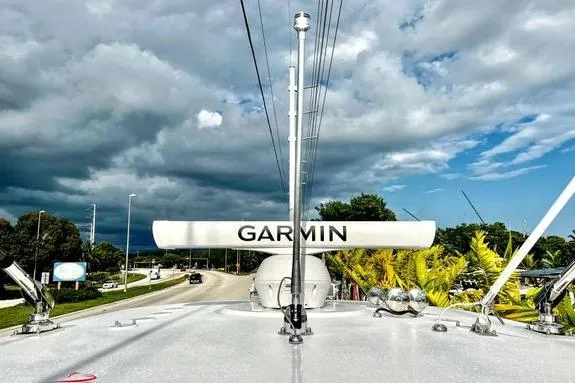 Slide: The Image of 2023 Fountain 38 Tournament Edition boat with Garmin radar, under cloudy sky. - 55
