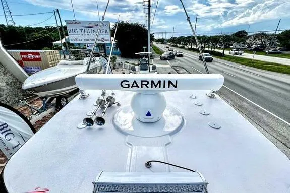 Slide: The Image of 2023 Fountain 38 Tournament Edition boat with Garmin radar, parked near a road. - 56