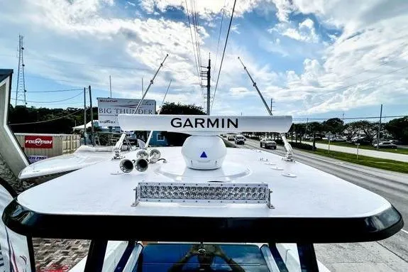 Slide: The Image of 2023 Fountain 38 Tournament Edition boat with Garmin radar, clear sky background. - 57