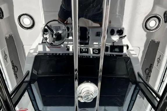 Slide: The Image of 2023 Fountain 38 Tournament Edition boat cockpit with steering wheel and controls. - 59