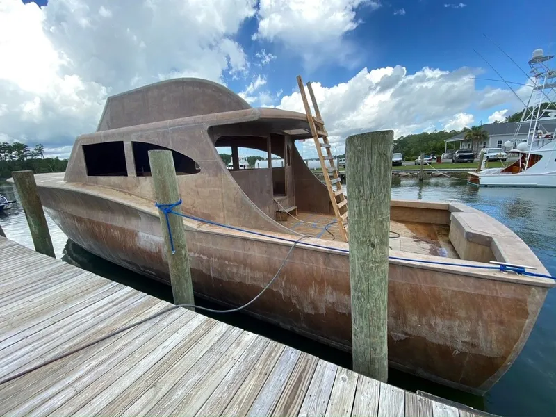 Slide: The Image of Unfinished 2020 Guthrie Custom Sportfish boat at dock. - 4
