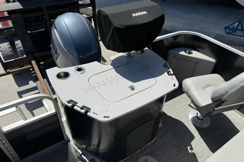 Slide: The Image of 2022 Bennington 22 SS Fish and Cruise boat interior with seating and motor. - 18