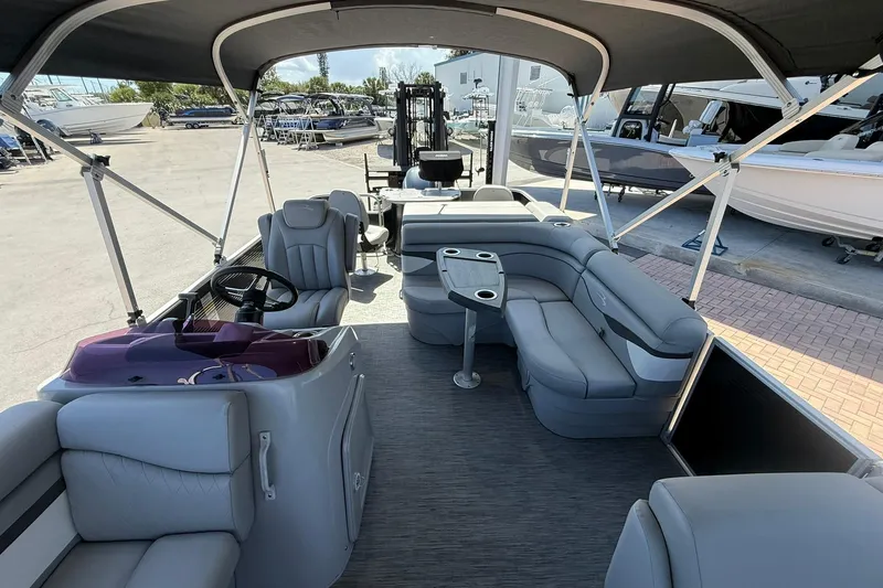 Slide: The Image of 2022 Bennington 22 SS Fish and Cruise pontoon boat interior with seating and helm. - 9