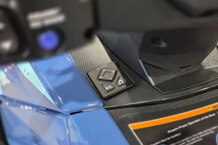 Slide: The Image of 2026 Yamaha WaveRunner VX Cruiser dashboard controls with blue accents and textured surface. - 14