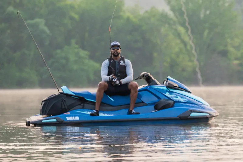 Slide: The Image of Manufacturer Provided Image: Man fishing on a 2026 Yamaha WaveRunner VX Cruiser in a serene lake setting. - 17
