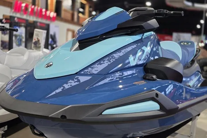 Slide: The Image of 2026 Yamaha WaveRunner VX Cruiser in showroom, featuring sleek blue design and modern styling. - 2