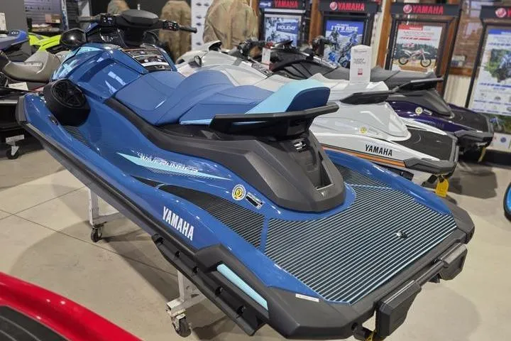 Slide: The Image of 2026 Yamaha WaveRunner VX Cruiser in showroom, blue and black design, displayed among other models. - 4