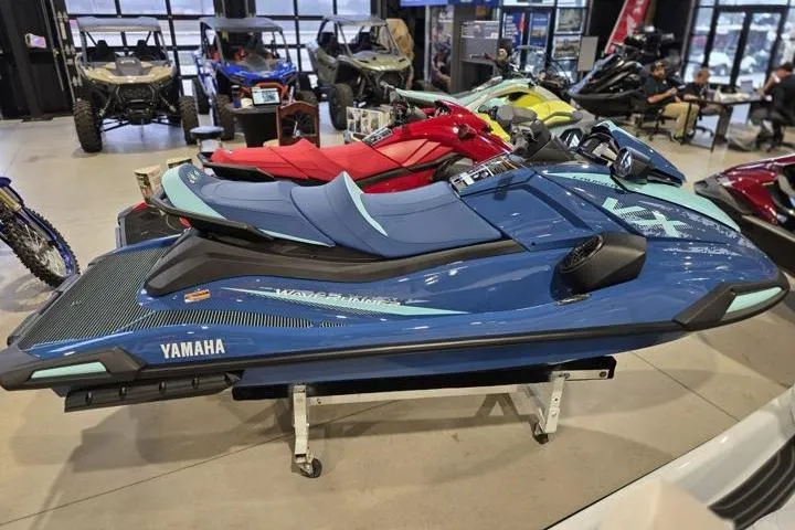 Slide: The Image of 2026 Yamaha WaveRunner VX Cruiser in showroom, blue color, displayed on stand. - 7