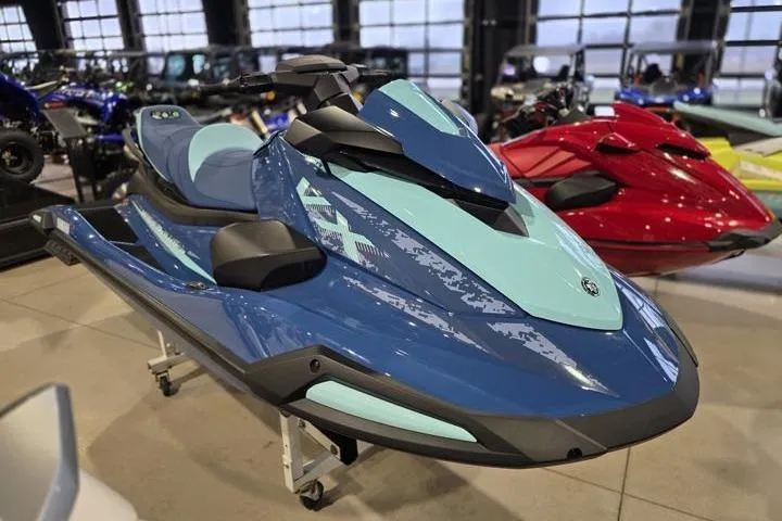 Slide: The Image of 2026 Yamaha WaveRunner VX Cruiser in showroom, sleek blue design, modern watercraft display. - 8