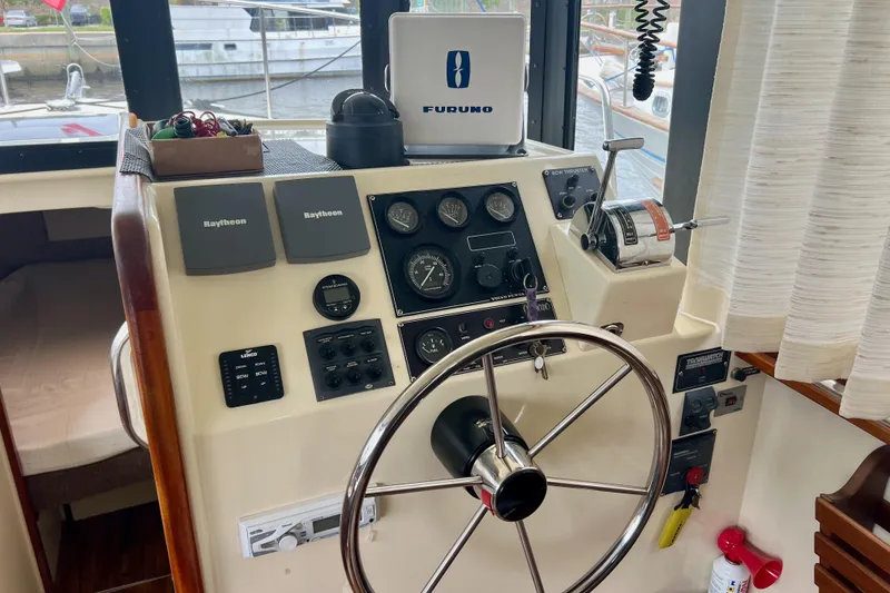 Slide: The Image of Helm of 2002 Camano Troll boat with navigation instruments and steering wheel. - 6