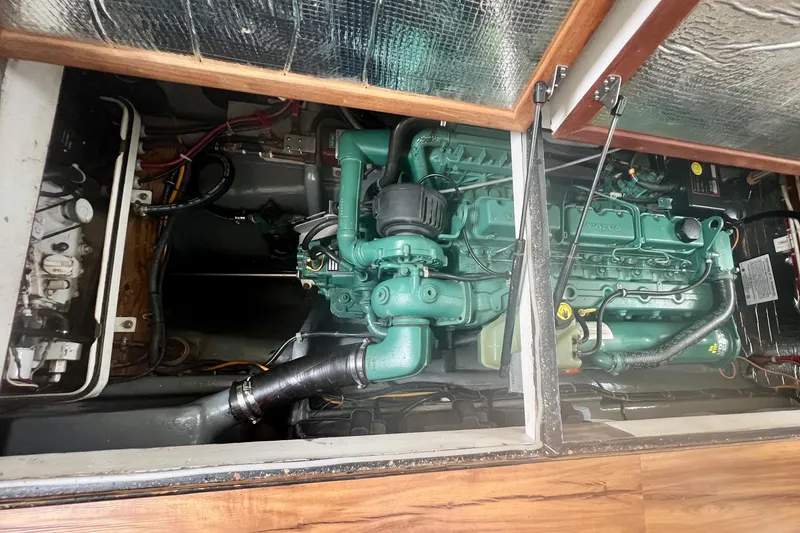 Slide: The Image of Engine compartment of a 2002 Camano Troll boat, featuring a Volvo engine. - 9