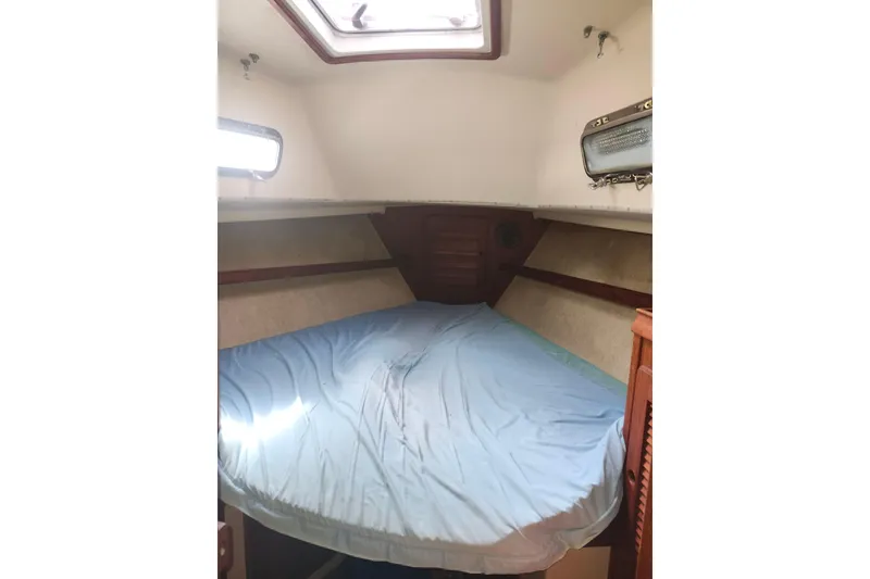 Slide: The Image of Interior cabin of 1994 Island Packet 32 sailboat with skylight and bed. - 19