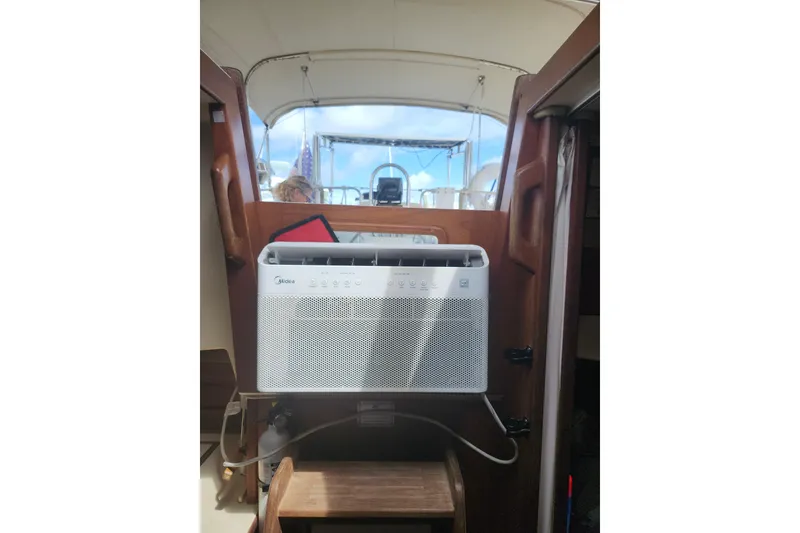 Slide: The Image of Air conditioner installed on 1994 Island Packet 32 sailboat interior. - 28