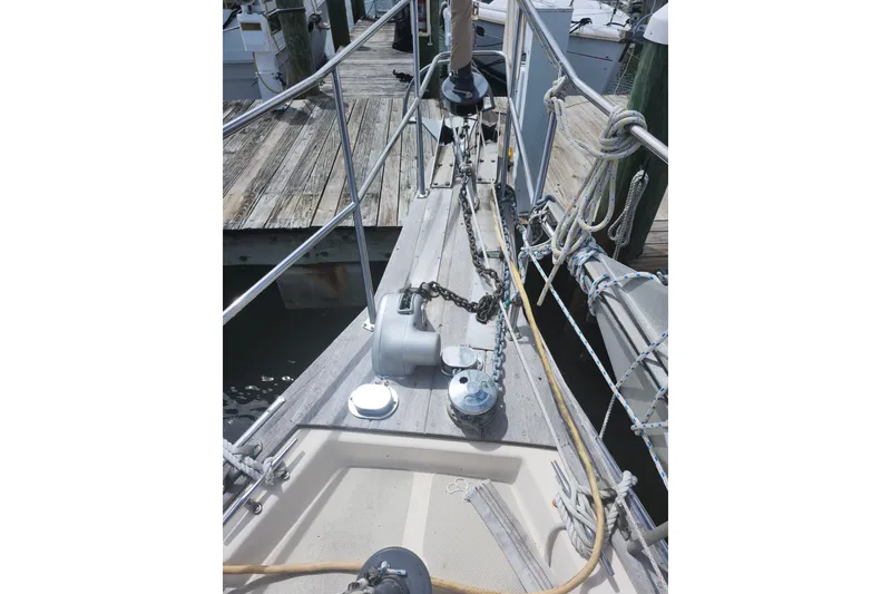 Slide: The Image of Bow view of 1994 Island Packet 32 sailboat docked at marina. - 6