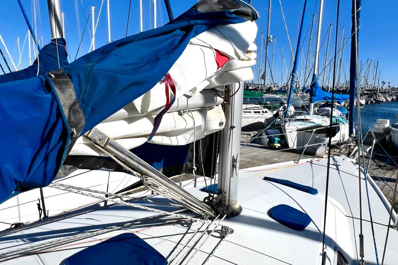 Slide: The Image of 1999 Catalina 36 MkII sailboat docked at marina with blue sail cover. - 10