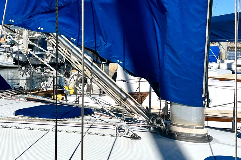 Slide: The Image of Close-up of a 1999 Catalina 36 MkII sailboat deck with blue sail cover. - 12