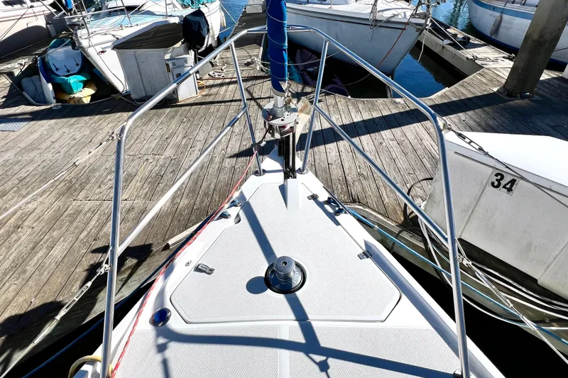 Slide: The Image of Bow of a 1999 Catalina 36 MkII sailboat docked at marina. - 13