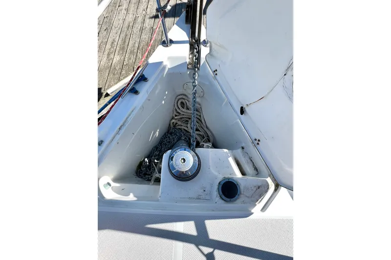 Slide: The Image of Anchor locker of a 1999 Catalina 36 MkII sailboat with ropes and chain. - 14