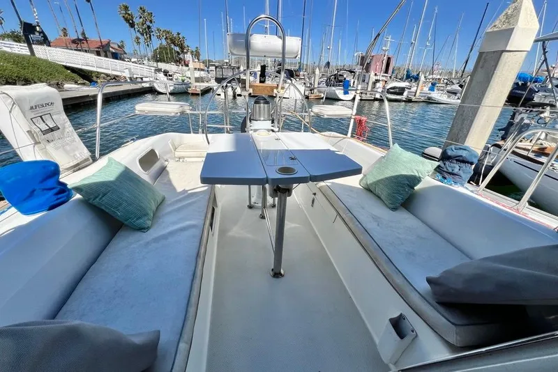 Slide: The Image of Cockpit of 1999 Catalina 36 MkII sailboat with seating and table, docked at marina. - 17