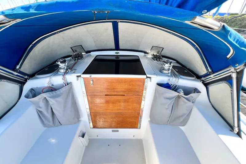 Slide: The Image of 1999 Catalina 36 MkII sailboat cockpit with blue canopy and wooden hatch. - 19