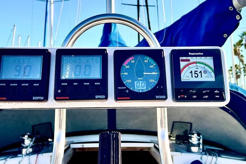 Slide: The Image of Sailing instruments on a 1999 Catalina 36 MkII, displaying depth, speed, and wind data. - 21