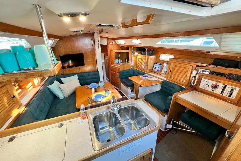 Slide: The Image of Interior of a 1999 Catalina 36 MkII sailboat with cozy seating and modern amenities. - 25