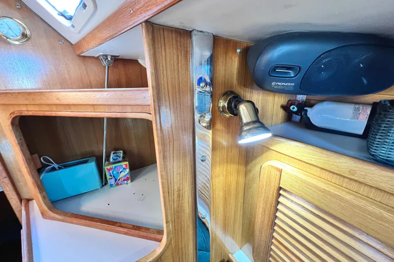 Slide: The Image of Interior of 1999 Catalina 36 MkII sailboat with wooden cabinetry and modern amenities. - 31