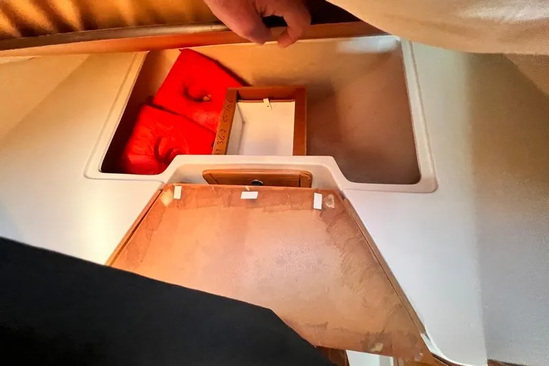 Slide: The Image of Interior view of 1999 Catalina 36 MkII sailboat cabin with storage compartment. - 39