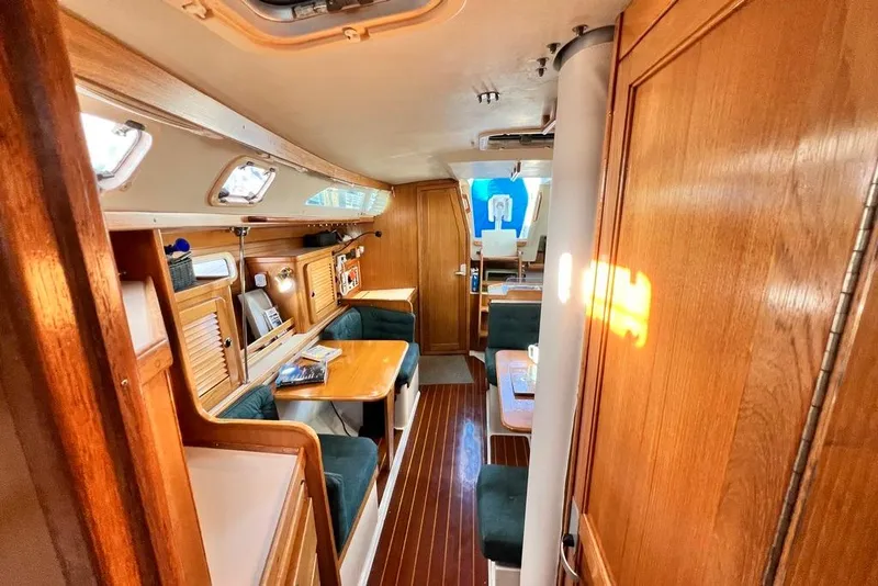 Slide: The Image of Interior of 1999 Catalina 36 MkII sailboat with wooden furnishings and seating area. - 40