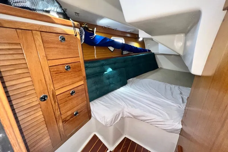 Slide: The Image of Cozy cabin interior of 1999 Catalina 36 MkII sailboat with wooden cabinetry and bedding. - 45