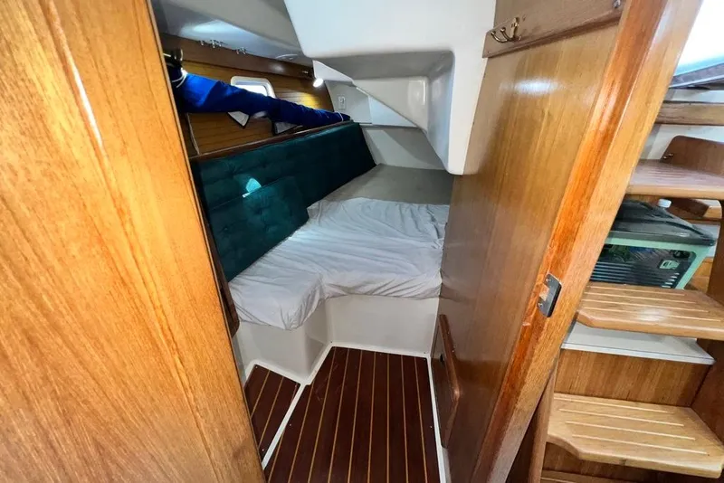 Slide: The Image of Cozy cabin interior of 1999 Catalina 36 MkII sailboat with wooden finishes. - 46