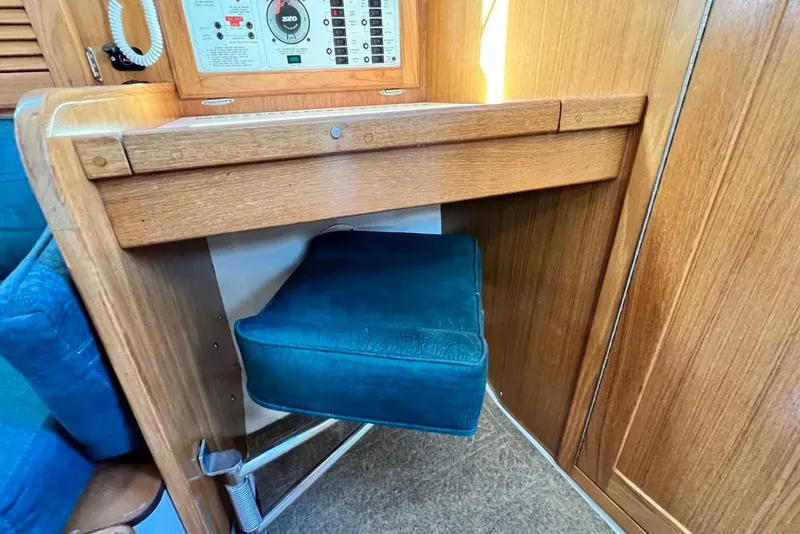 Slide: The Image of 1999 Catalina 36 MkII interior with wooden paneling and cushioned seat. - 48