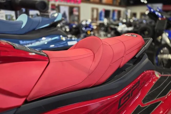 Slide: The Image of 2026 Yamaha WaveRunner GP SVHO with red seat, showcased in a showroom. - 12