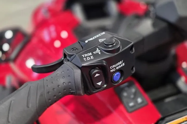 Slide: The Image of Close-up of 2026 Yamaha WaveRunner GP SVHO handlebar controls, featuring trim and cruise options. - 18