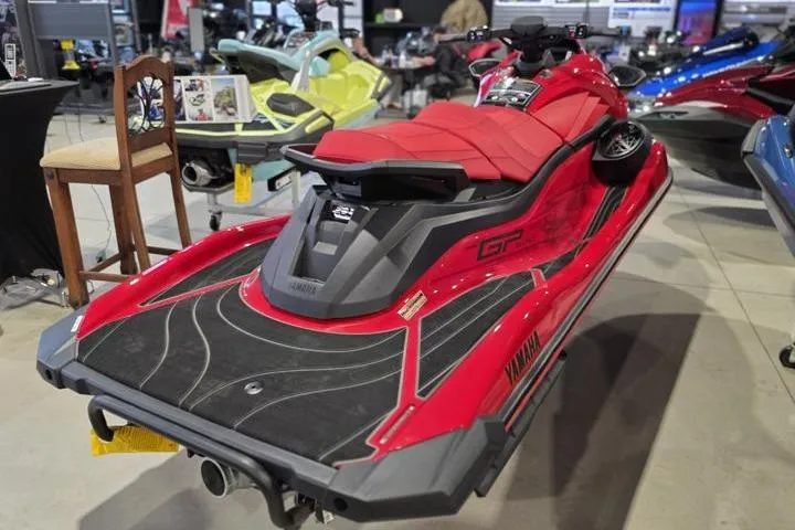 Slide: The Image of 2026 Yamaha WaveRunner GP SVHO in vibrant red on display indoors. - 6