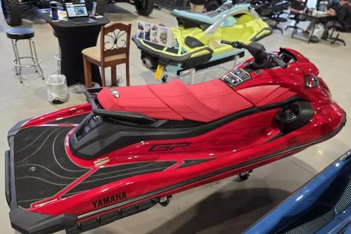 Slide: The Image of 2026 Yamaha WaveRunner GP SVHO in vibrant red on display indoors. - 7