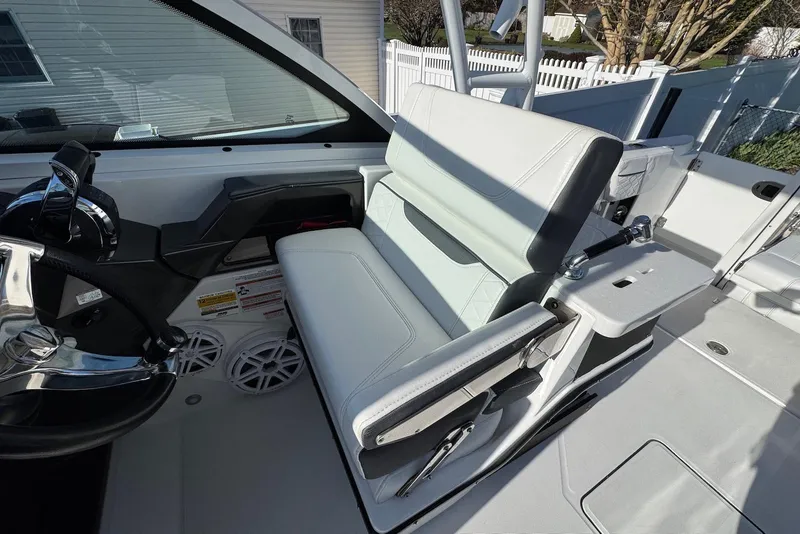 Slide: The Image of 2021 Blackfin 252 DC boat interior with helm and seating area. - 18